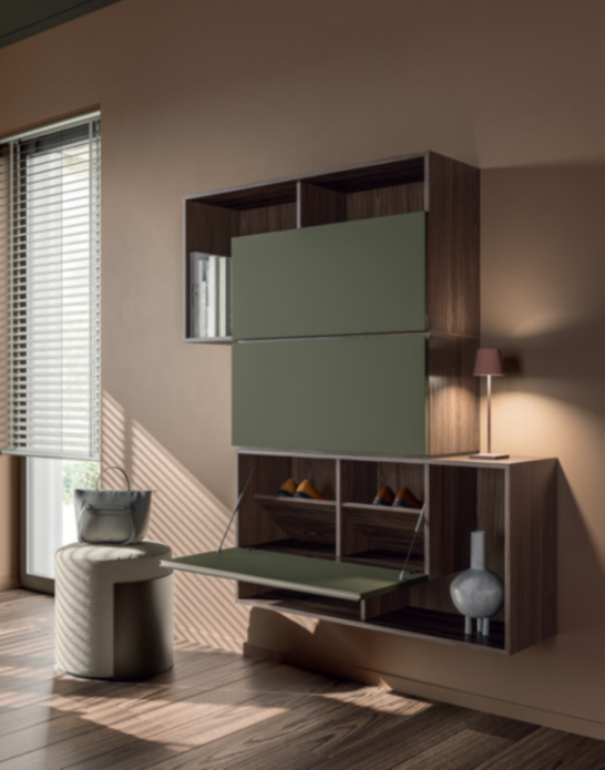 INGRESSO SCARPIERA _ GSS01DR Modular wall shelving unit in a modern living space, featuring green accents and decorative items.