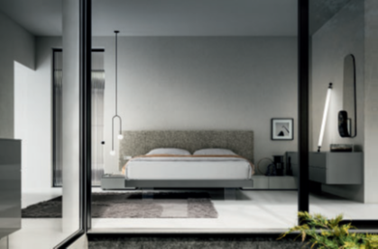 CAMERA LUMINOSA Modern bedroom with a minimalist design, large windows, and soft lighting.