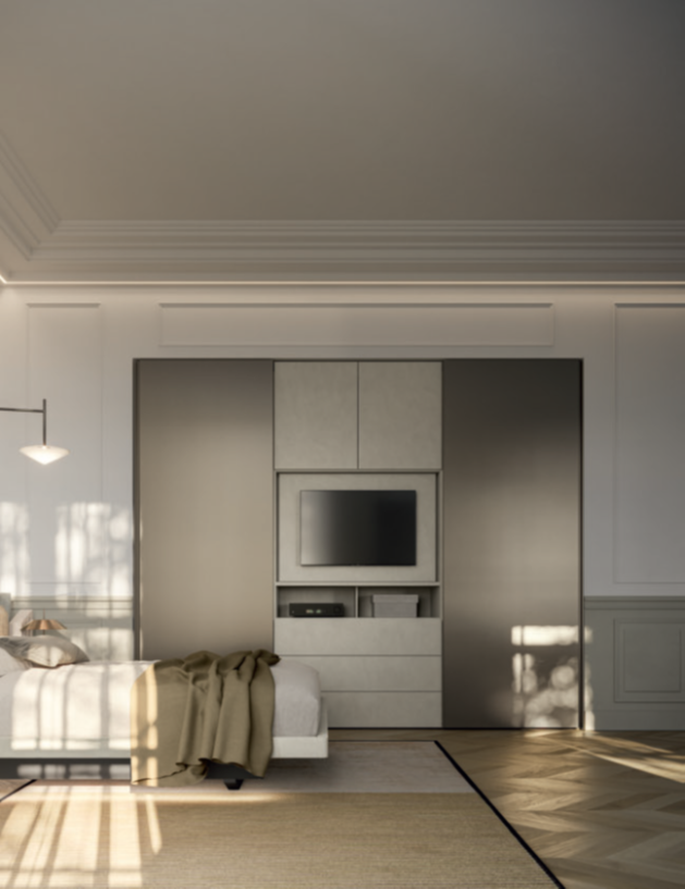 ARMADIO CON ANTE, CASSETTI E CON PORTA TV Camera view of a modern bedroom with minimalist decor and a TV on a cabinet.