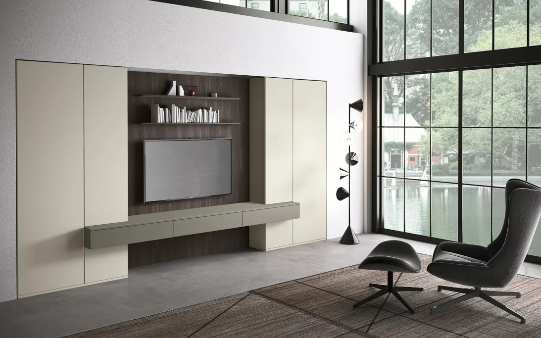 Modern living room with a minimalist entertainment unit, armchair, and large windows.