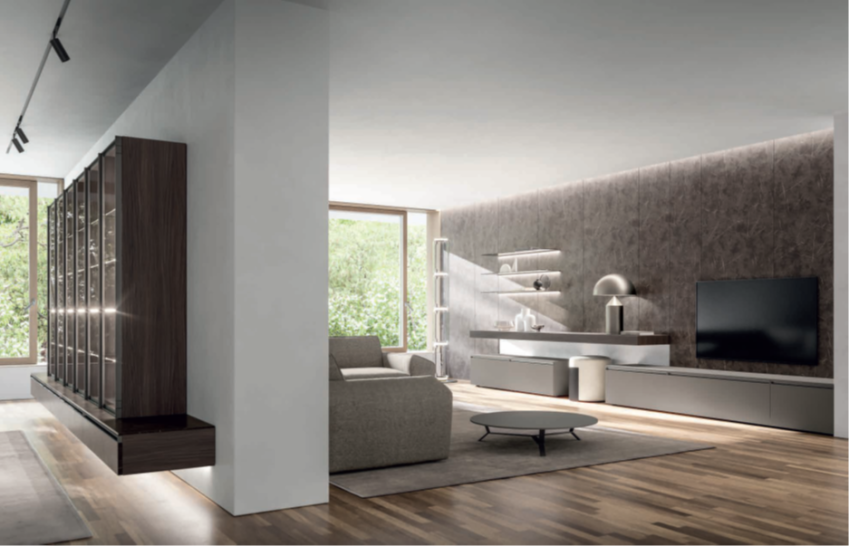 COMPOSIZIONE SALA HNG064 Modern living room with wooden floors, a large TV, and natural light from windows.