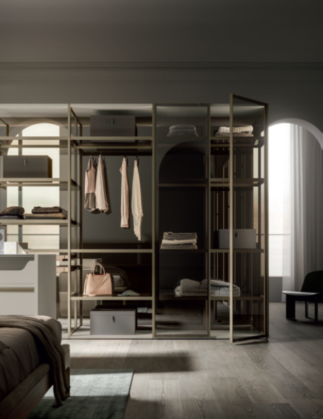 ARMADIO APERTO OPEN Modern bedroom with a stylish open wardrobe and soft lighting.