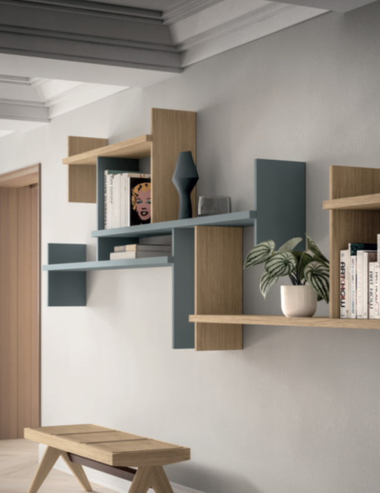 MENSOLE AKKA Modern wall shelves in wood and blue, featuring books, a plant, and a decorative item.