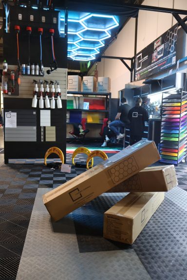 Spacious interior with colorful flooring, stacked wooden blocks, and activity areas.